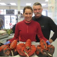 Fine Kettle o Fish Kathy and Bob holding 3 very large lobsters