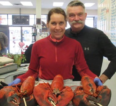 Fine Kettle o Fish Kathy and Bob holding 3 very large lobsters