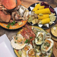 Kettle o Fish Baked Oysters Lobster and corn picnic meal
